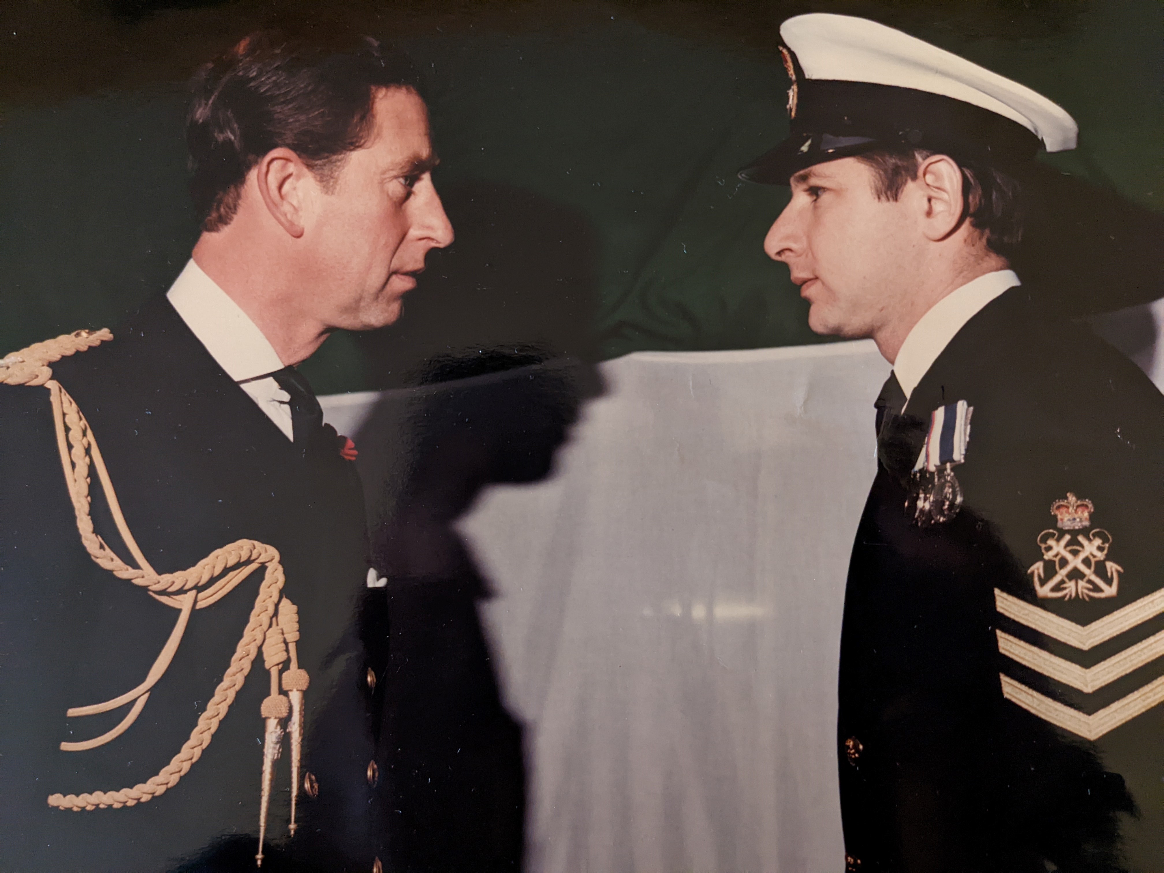 Graham Walker receives medal from Prince Charles aboard HMS York